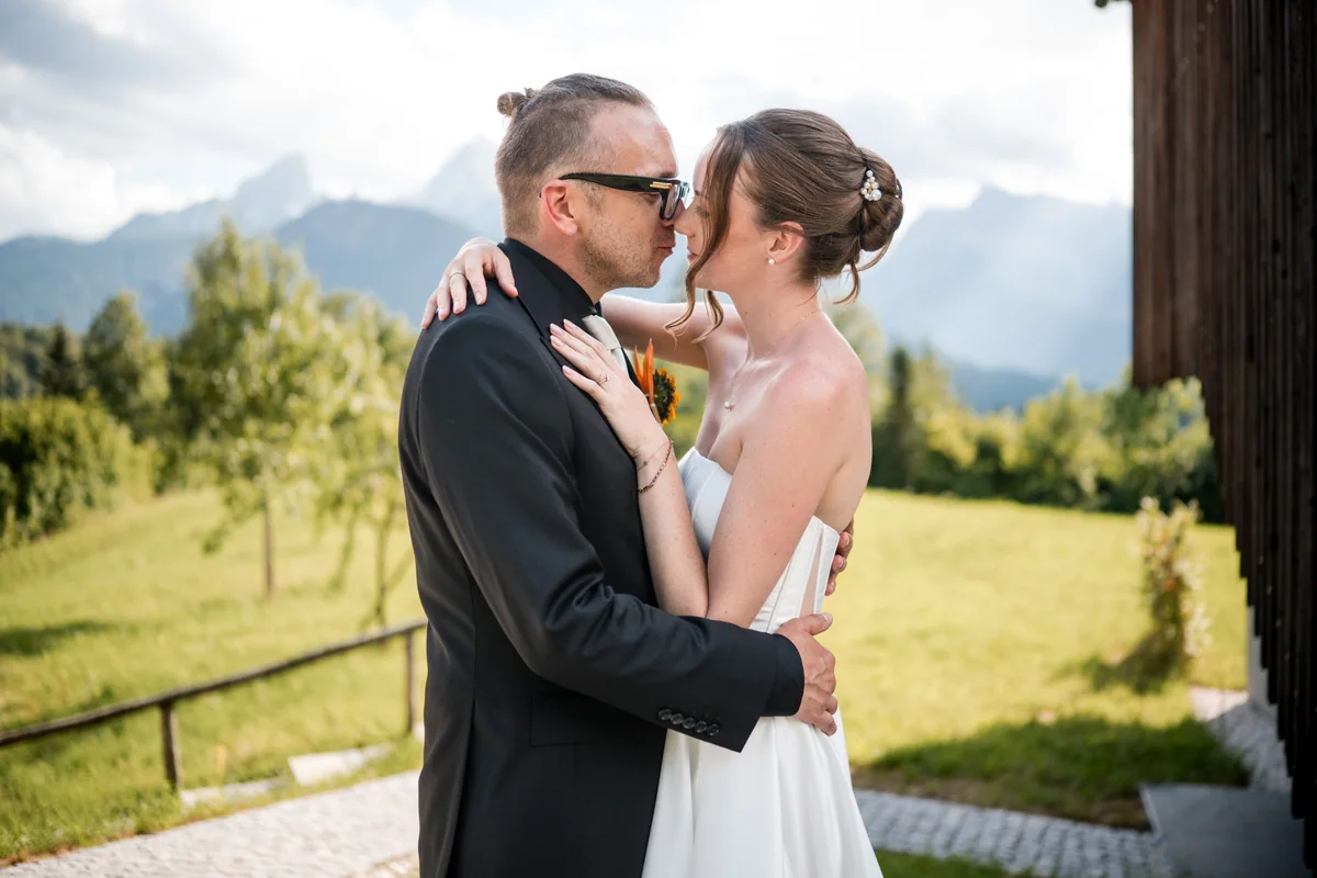 Brianna and her husband stand close together.