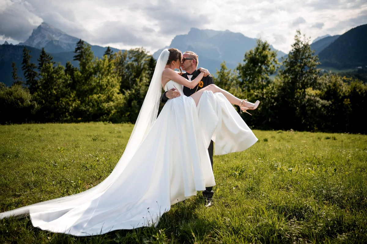 Brianna laughs in her husband’s arms.