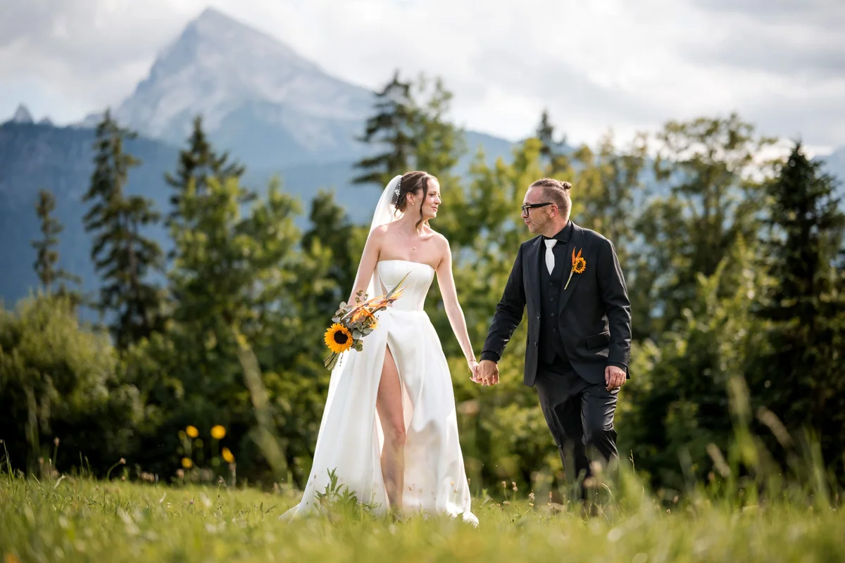 Brianna and her husband look at each other as they walk.