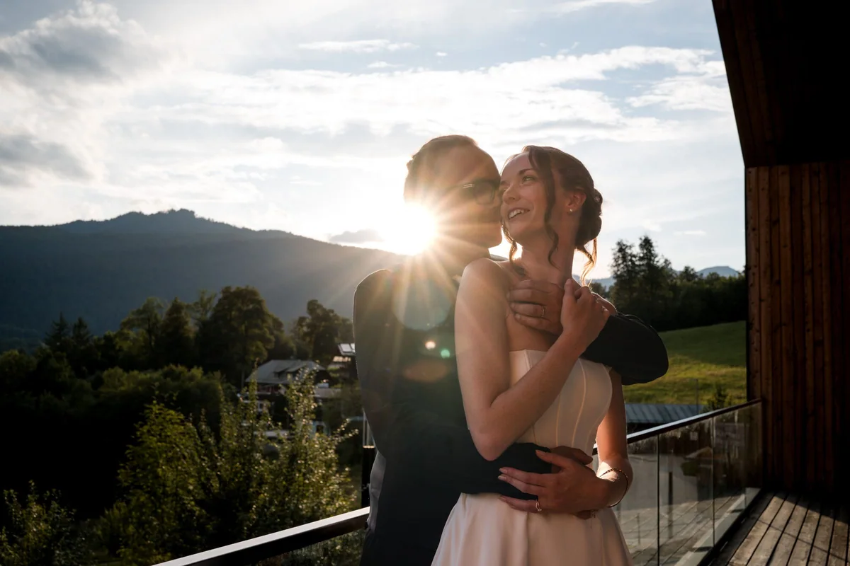 Brianna and her husband embrace in the last sunlight.