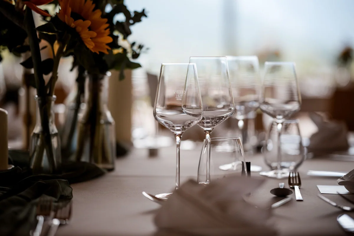 Glasses and sunflowers on the wedding table.
