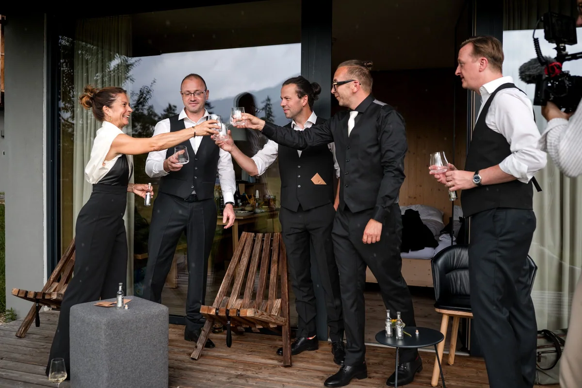 The groom toasts with his friends.