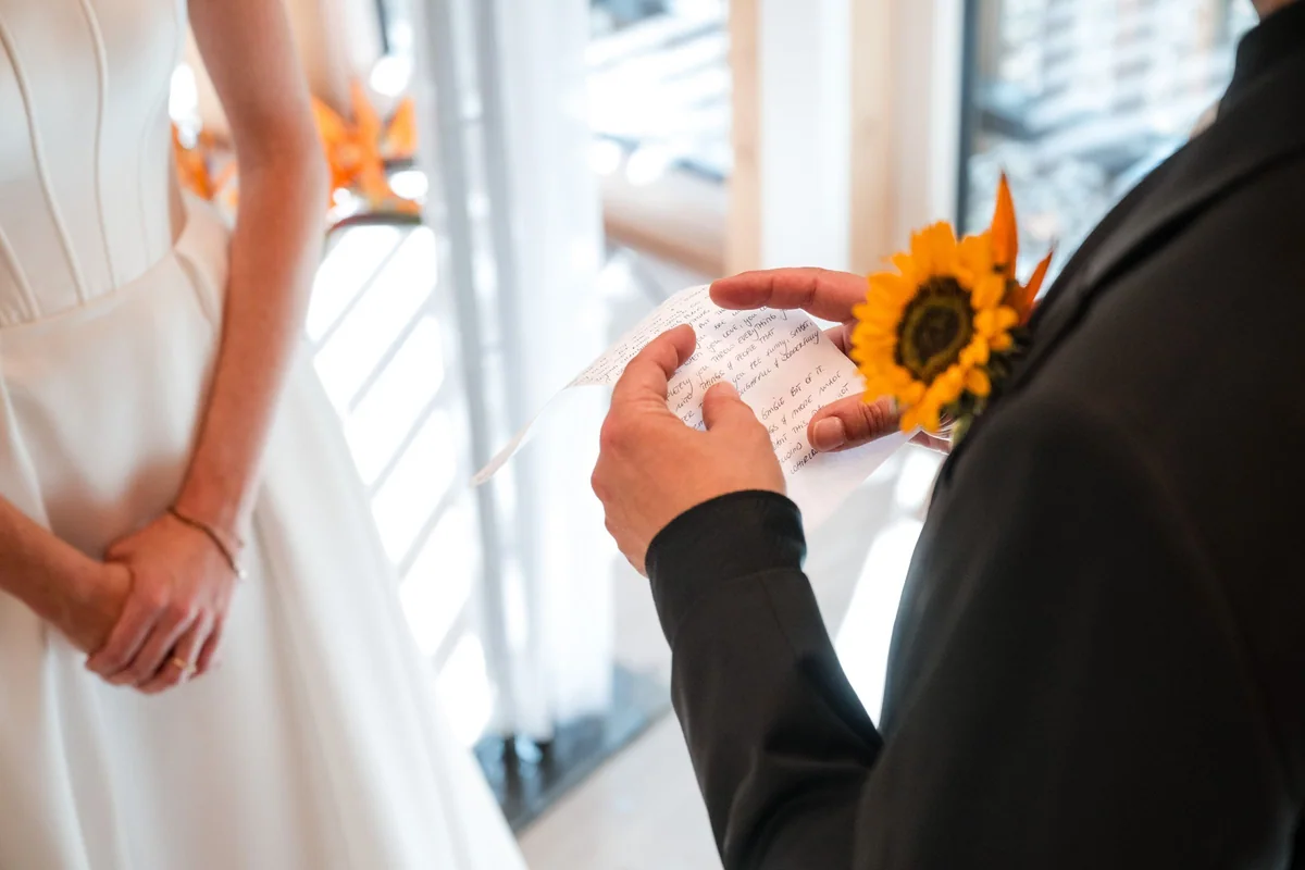 The groom reads his words to Brianna aloud.
