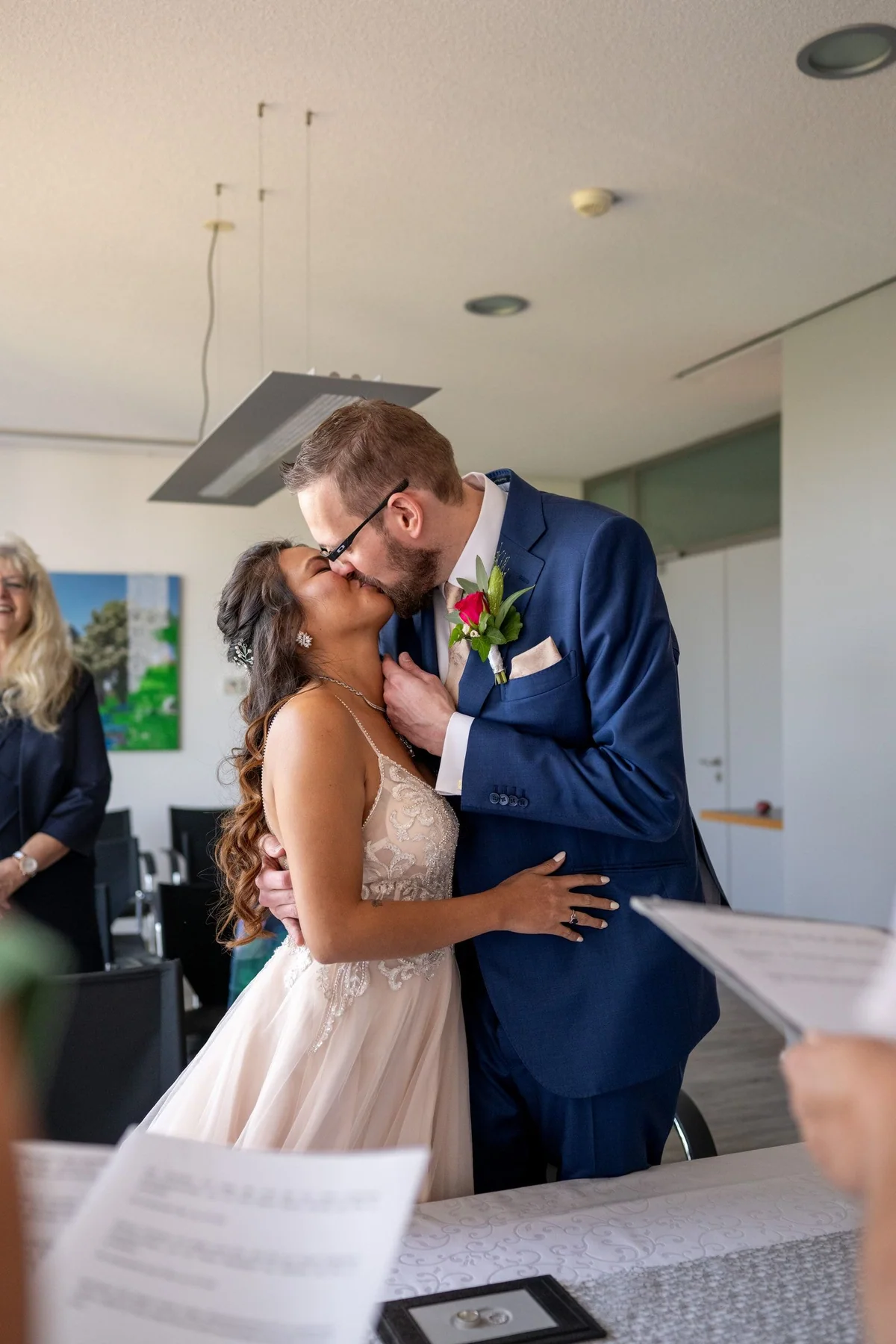 The couple kiss in the ceremony room in Waldbronn.